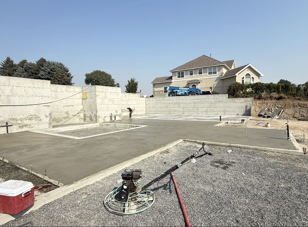 Concrete pool base and surrounding flatwork