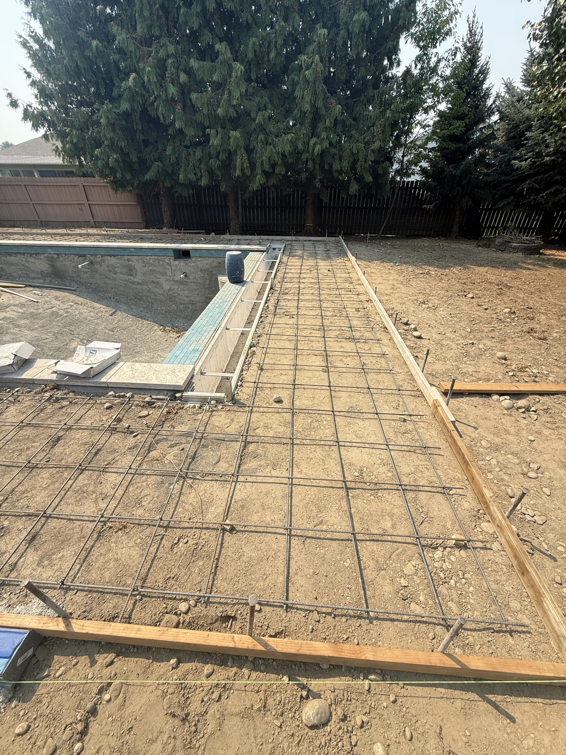 Pool deck forms and reinforcing steel